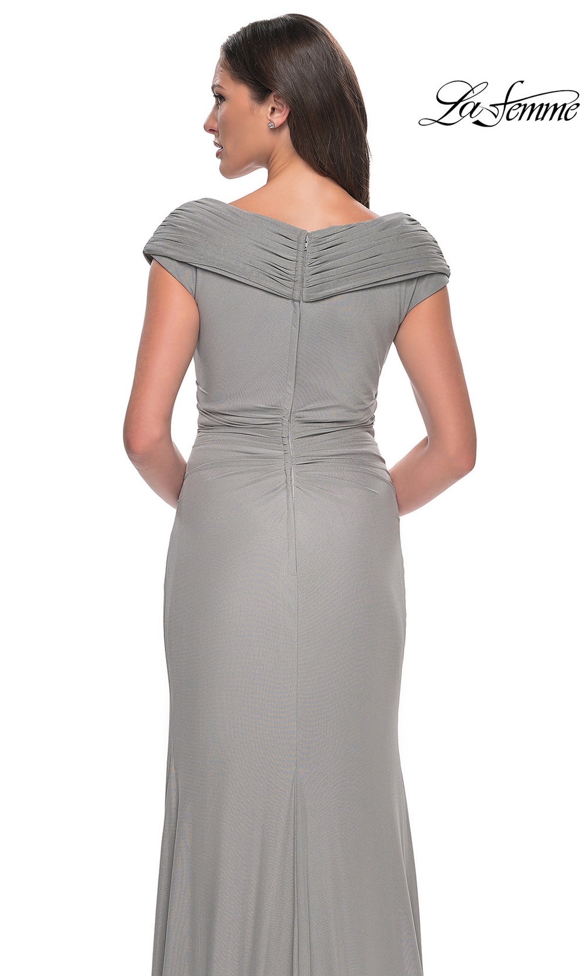 Back view of a woman wearing a gray, off-the-shoulder Long Formal Dress: La Femme 29996, featuring a draped, floor-length silhouette.